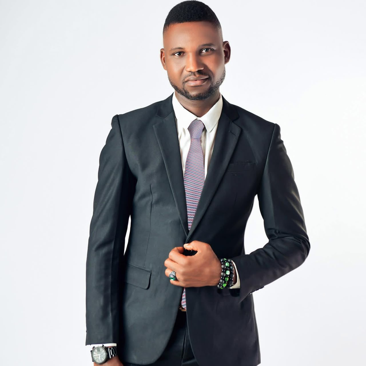 Anthony Ayodele in a black suit