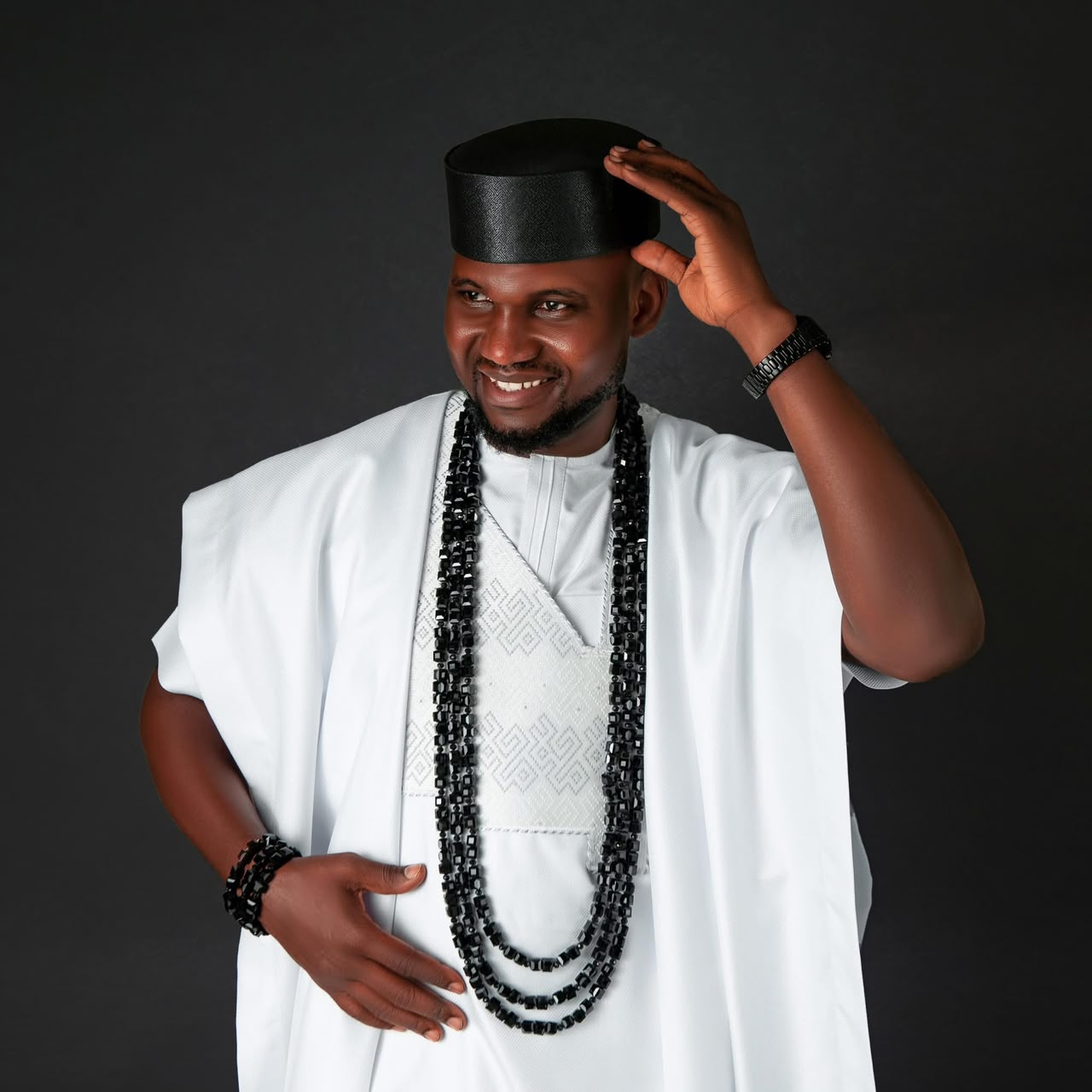 Anthony Ayodele in white traditional attire